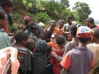 Sue handing out photos to the local children on route