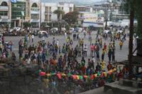 People gathering to watch the match on a big screen