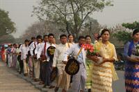 Family and friends dress up for the procession