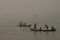 Fishing for logs on the Irrawaddy River