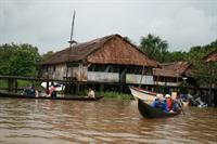 Departing on a trip in dugout canoes