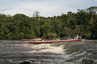 Low water levels mean that there is a risk of the boat hitting rocks, hence only the crew stay on the boat to navigate the rapid.