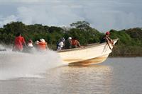 The boats racing each other.